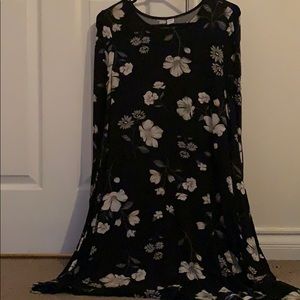Black dress with flowers. Past the knees